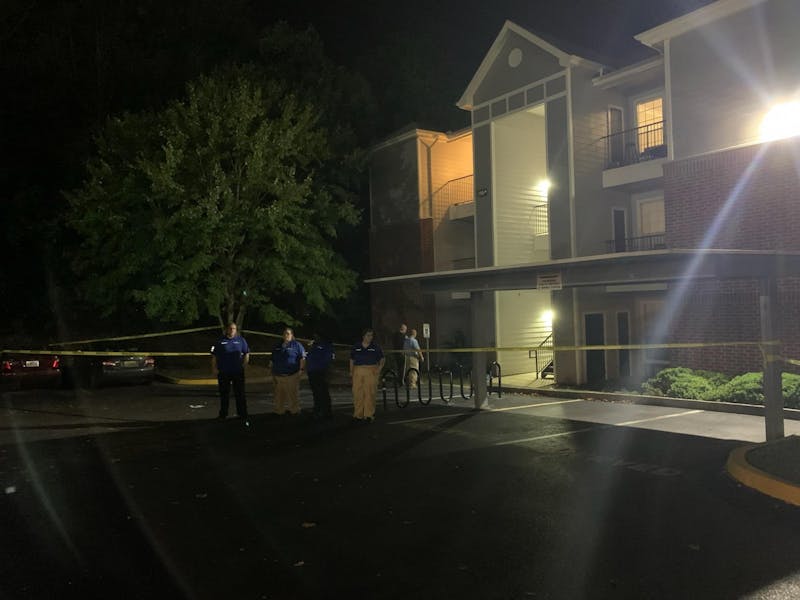 Crime scene tape surrounds building 13 of The Beacon apartment complex in south Auburn, where police were investigating a fatal possible shooting Thursday night.