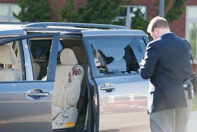 Three windows were shot out of a Toyota minivan which was parked in front of the Higginbotham Academic Center. (Jillian Clair / news Editor)