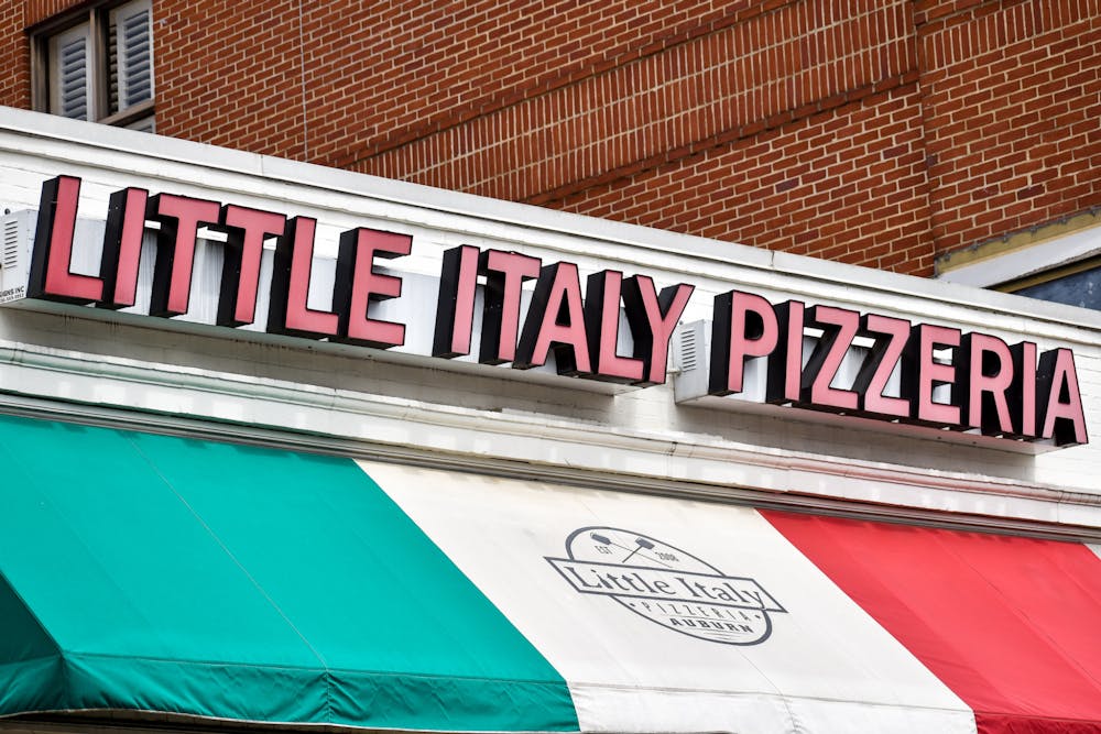 <p>The front-door sign of East Magnolia's Little Italy Pizzeria, the Plainsman's Choice for Best Pizza around the Auburn community on March 30, 2022.</p>