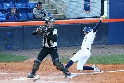 Junior utility player Brooke Lathan, No. 2, slides into home plate during Auburn's matchup against Appalachian State University Sunday afternoon. The call was out on Lathan, but the Tigers beat the Mountaineers 6-2. (Rebecca Croomes / PHOTO EDITOR)