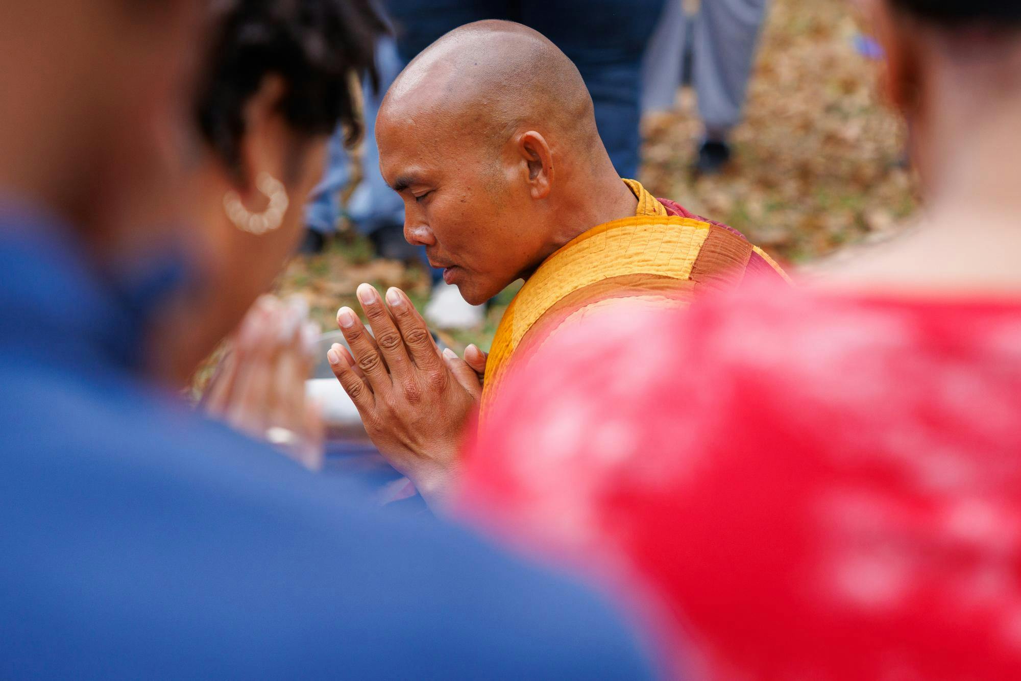Venerable Monk Bhikkhu Pannakara leads a moment of quiet, mindful presence during a lunch stop in Cusseta, Ala. after walking from Opelika on Dec. 26, 2025.