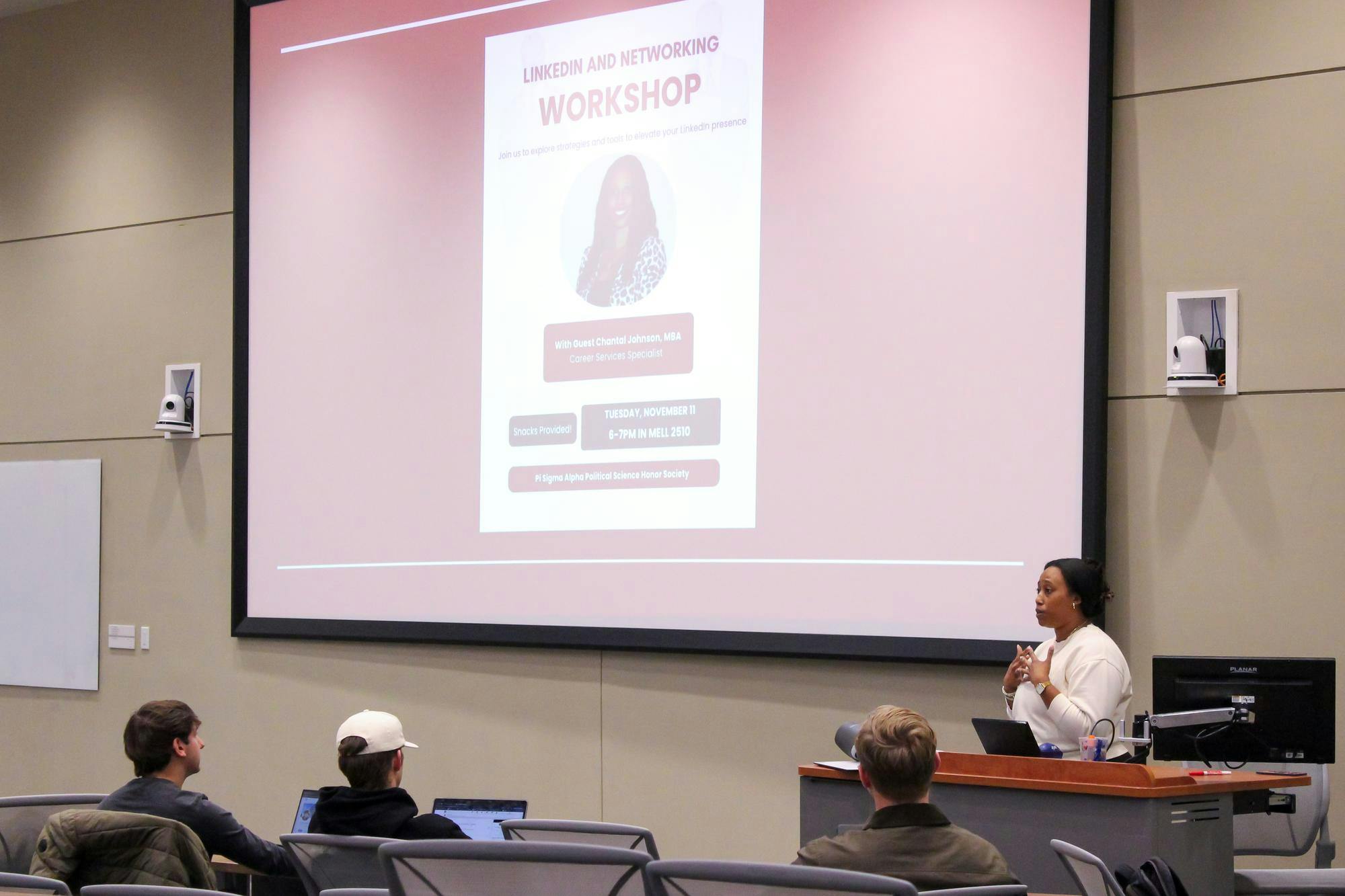 Career Services Specialist Chantal Johnson speaks to members of Pi Sigma Alpha at a networking event in the Mell Classroom Building on Nov. 11, 2025.