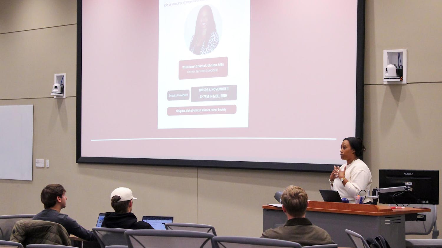 Career Services Specialist Chantal Johnson speaks to members of Pi Sigma Alpha at a networking event in the Mell Classroom Building on Nov. 11, 2025.