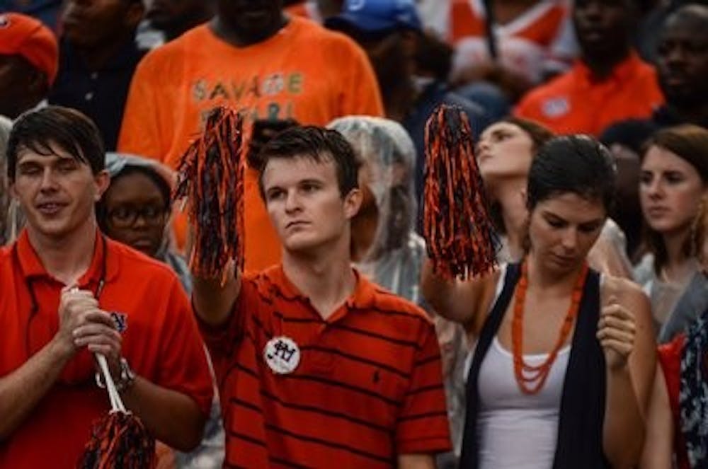Soaked Auburn fans after the loss to MSU.

Raye May / PHOTO EDITOR