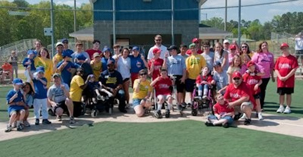 The Miracle League Cubs and Phillies pose for a group picture after their game Sunday. Philip Smith / ASSISTANT PHOTO EDITOR