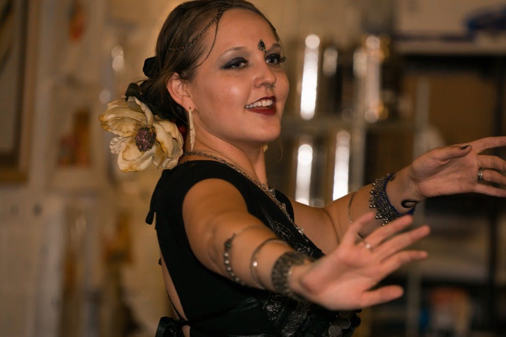 <p>Alex Johnson of Village Plains Tribal Fusion dance group showcases her talent at Coffee Cat in downtown Auburn on Friday, Sept. 4th. (David Topper | Photographer)</p>