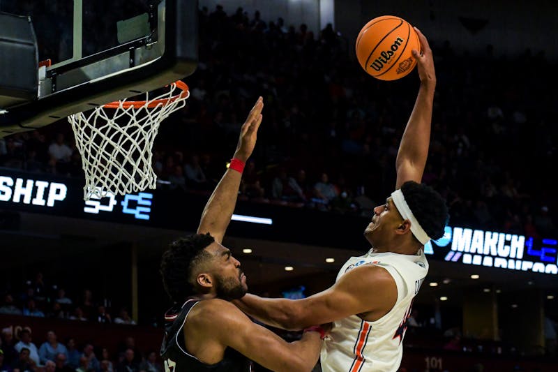 Dylan Cardwell (44) attempts to posterize a Gamecock defender in the Tigers' first-round win over Jacksonville State in the NCAA Tournament on March 18, 2022.