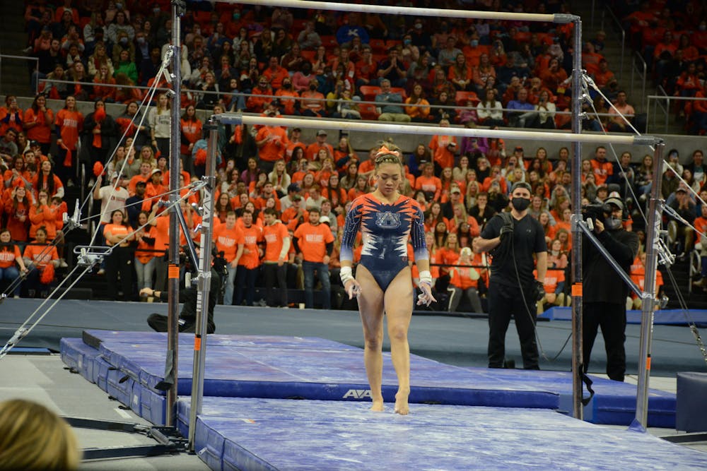 <p>Jan. 28, 2022; Sunisa Lee competes on bars in a meet against Alabama from Auburn Arena in Auburn, Ala.</p>