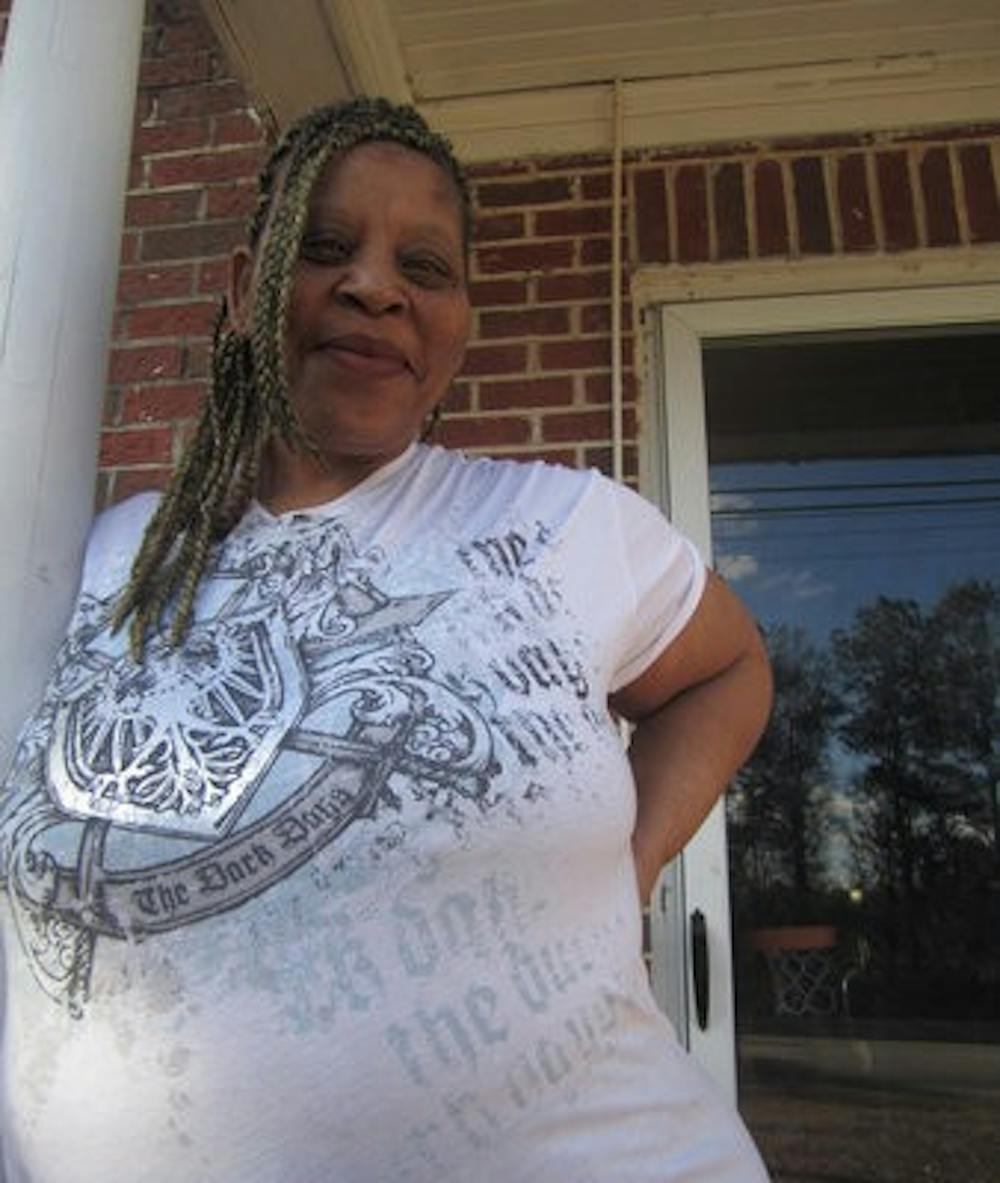 Anginette Tinsley stands on the front porch of her daughter's home, where she's staying for the time being.