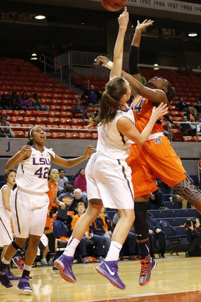 #44 Tra'cee Tanner battles to keep the ball in play. Auburn vs. LSU at Auburn, AL. Ellen Jackson | Photographer