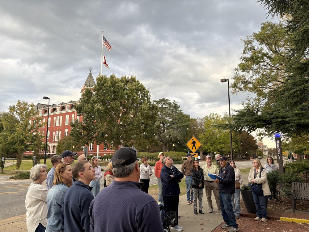 <p>The Faculty Row Walking Tour stopping by Mary E. Martin Hall. </p>