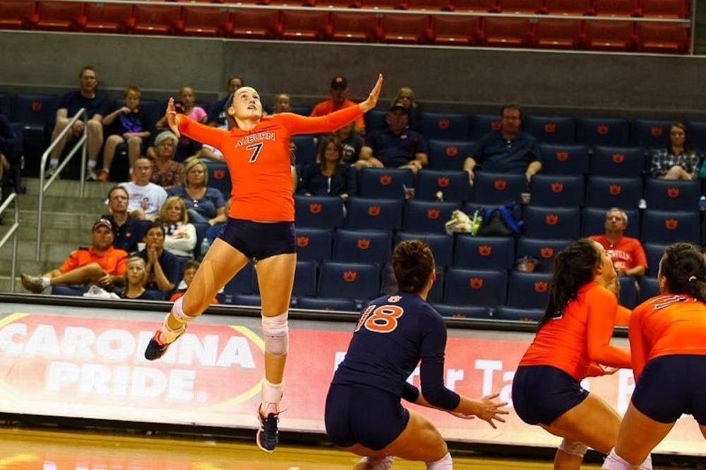 Courtney Crable (#7) jumping to hit the ball. (Kenny Moss | Photographer)