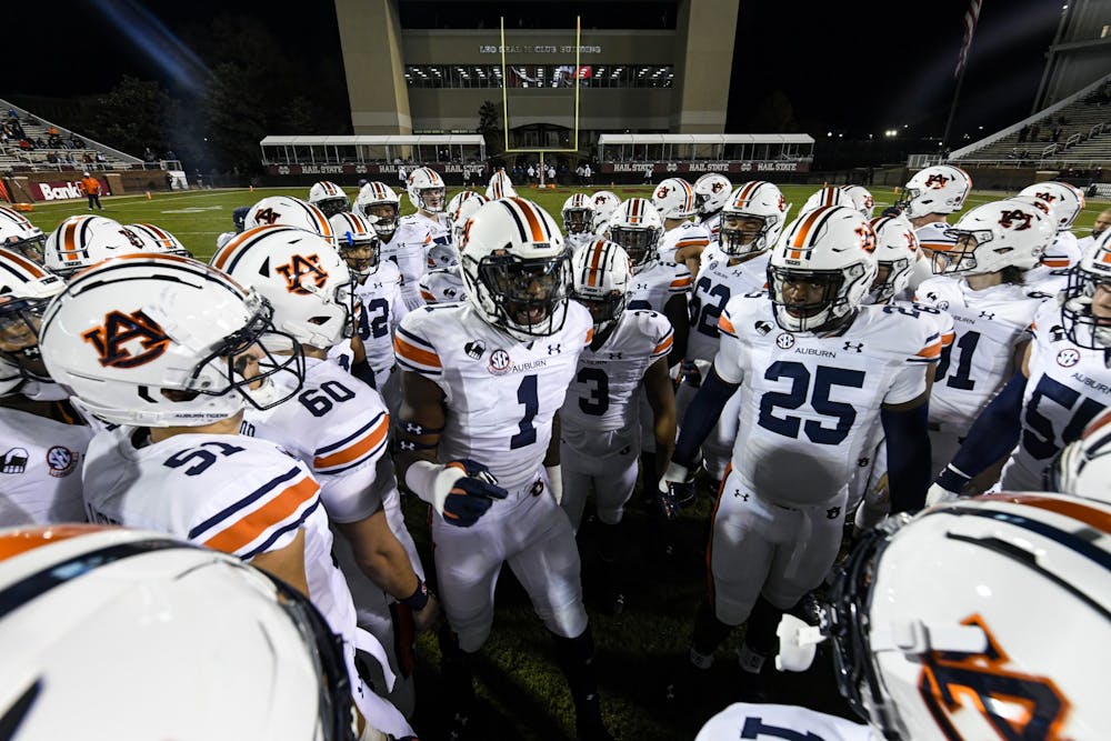 <p>Big Kat Bryant (1) in the huddle before the game between Auburn and Mississippi State at Davis Wade Stadium on Dec 12, 2020; Starkville, Mississippi, USA. Photo via: Todd Van Emst/AU Athletics</p>