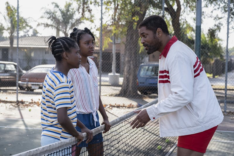 Richard Williams [played by Will Smith] talks to his young tennis stars, Venus and Serena [played by Saniyya Sidney and Demi Singleton, respectively] in the new film, "King Richard.