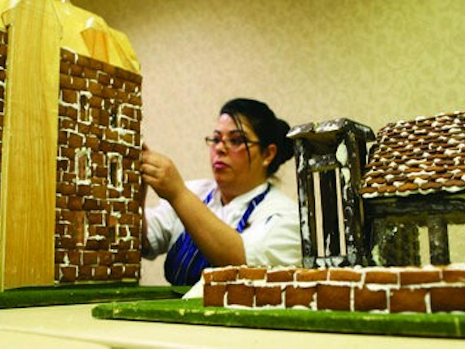 Chef Adelle Bonilla leads a team to create an Auburn gingerbread village masterpiece each year. Last year she used 90 eggs, 80 pounds of flour, 30 pounds of sugar, 7 pounds of molasses and 5 pounds of ground sugar, cinnamon and nutmeg to finish the job. (Rebecca Croomes / ASSISTANT PHOTO EDITOR)