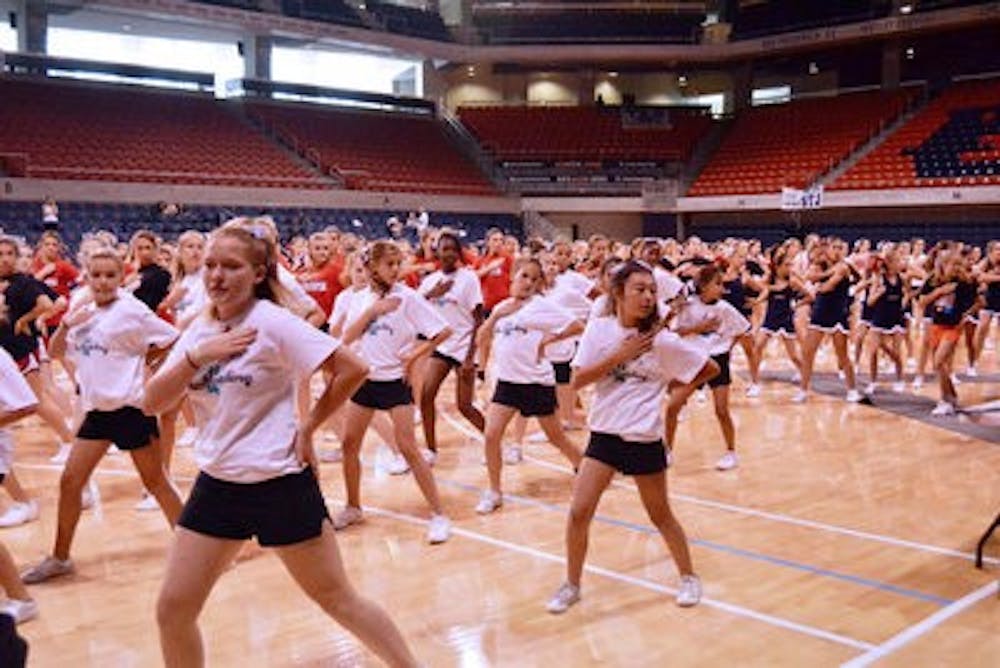 Cheerleading campers practice their routines in the Auburn Arena. (Danielle Lowe / PHOTO EDITOR)