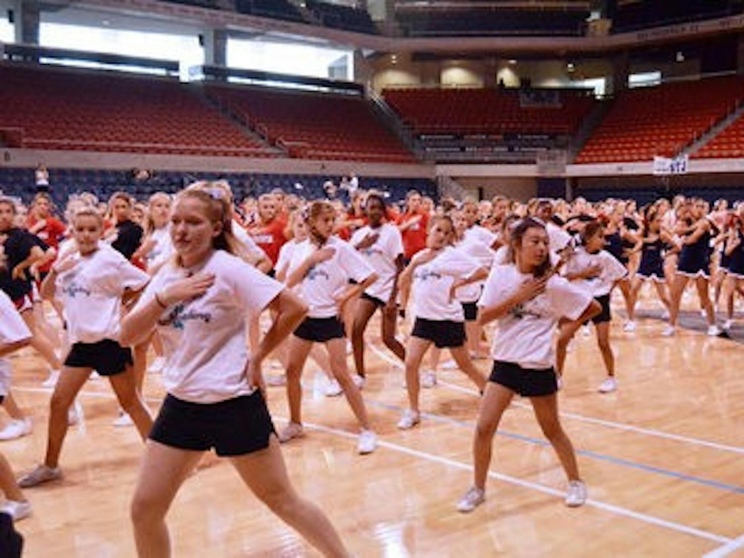 Cheerleading campers practice their routines in the Auburn Arena. (Danielle Lowe / PHOTO EDITOR)