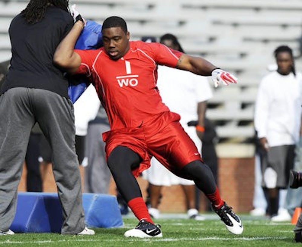 Former Auburn defender Nick Fairley runs drills for NFL scouts Tuesday afternoon. (Todd Van Emst / Auburn Media Relations)