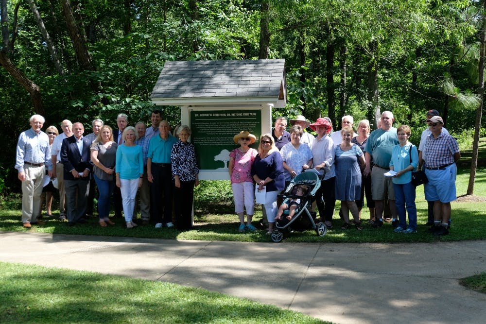 Group poses for photo at the George Bengston Tree Trail Dedication