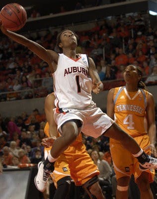 Auburn's Morgan Toles drives to the basket during the first half of play. (Todd Van Emst / Auburn Media Relations)
