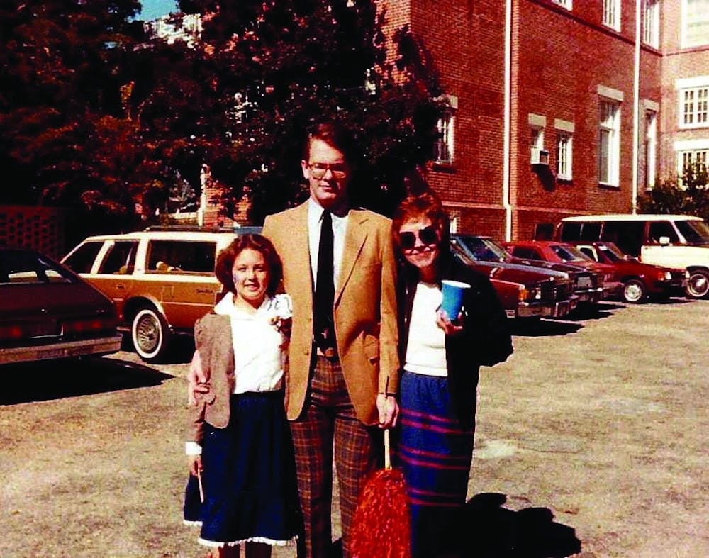 Kristen, Mark and Betty Qualls attend the Auburn Homecoming football game in 1983.
