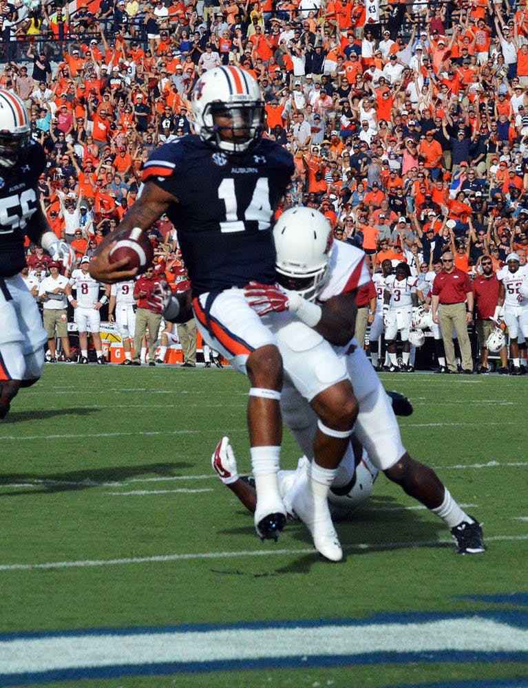 Nick Marshall (#14) scores touchdown. (Emily Enfinger | Assistant Photo Editor)