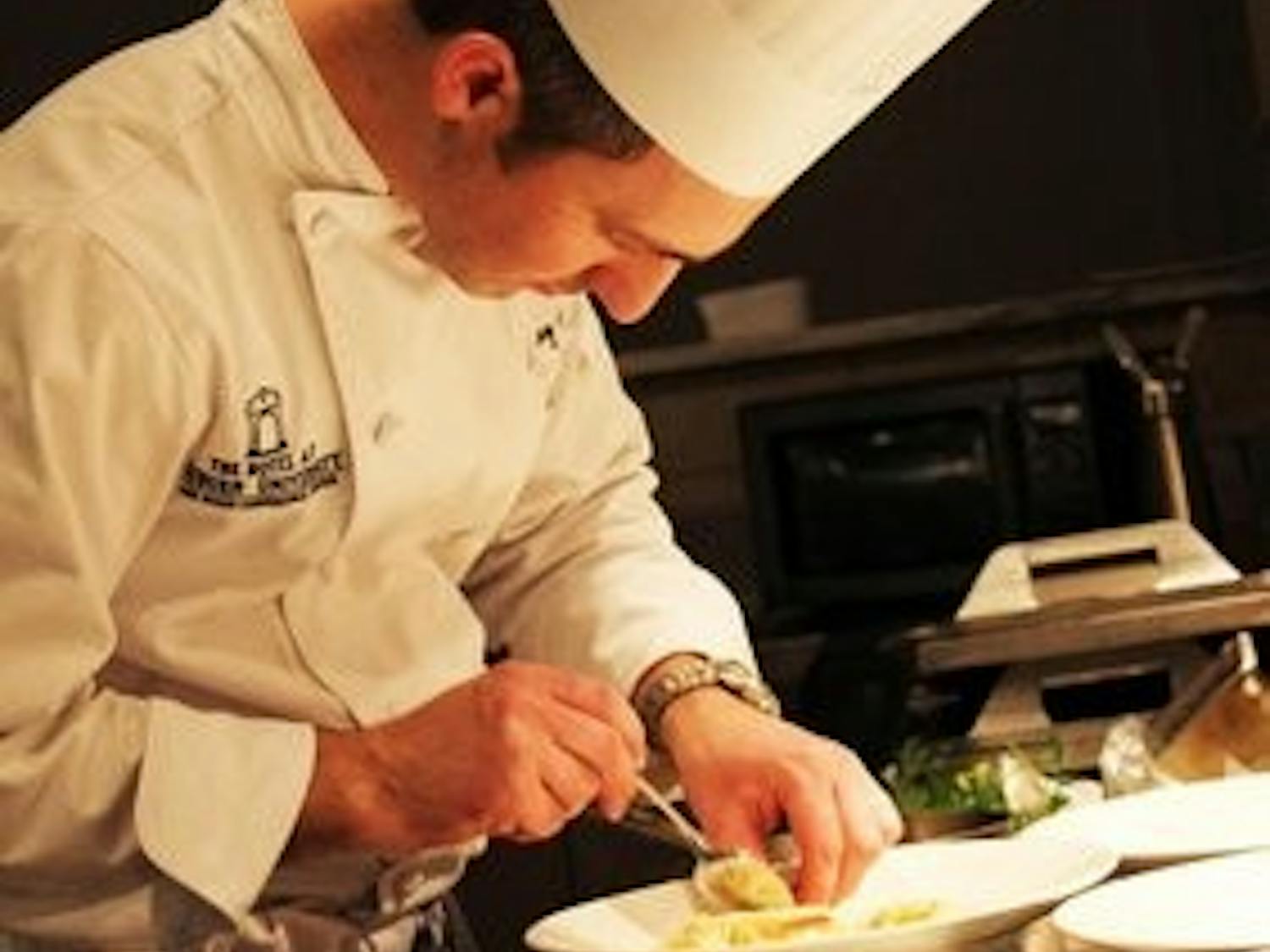 Sous chef Garry Anderson prepares pasta for dinner rush at Ariccia. (Emily Morris / ASSISTANT PHOTO EDITOR)