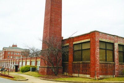 The L-Building, built in 1923, is set to be demolished after plans are finished for the relocation of its occupants. The L-Building currently houses Photographic Services, IT User Services, Digital Repair and Engineering Network Services, as well as workspace for several engineering programs. (Rebecca Croomes / PHOTO EDITOR)