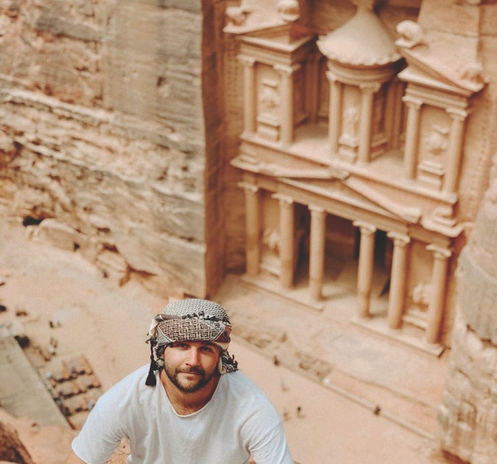 <p>Jonny Bradford in front of Petra, a popular tourist site in Jordan.</p>