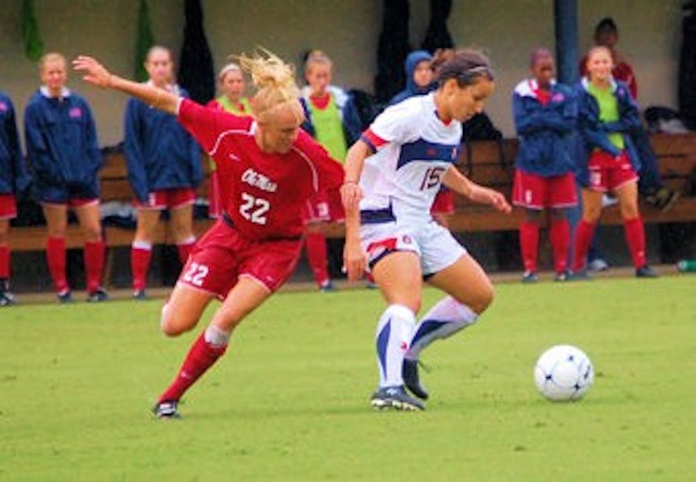 Sophomore midfielder Ana Cate defends the ball from Ole Miss junior Kendyl Mygatt. (Katie Shelton / Photo Staff)