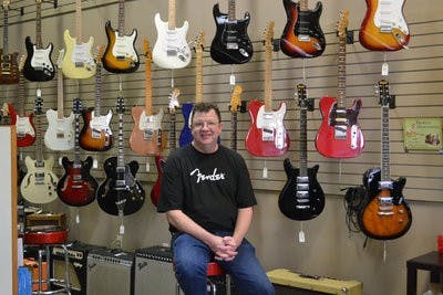 Tom O'Shea teaches English at Auburn and also owns local music store, The Guitar Shoppe. (Raye May / PHOTO EDITOR)