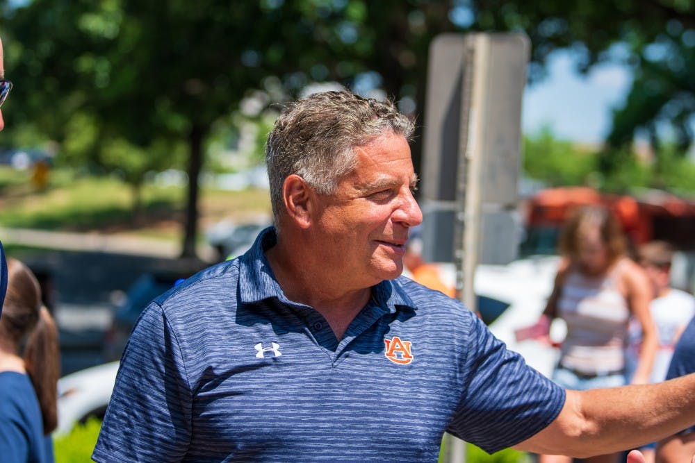  Bruce Pearl waves to a fan at the Welcome home of Auburn Baseball from the NCAA Atlanta Regional on Monday, June 3, 2019, in Auburn, Ala.
