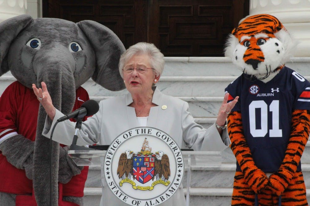 <p>Gov. Kay Ivey speaks on the Capitol steps during the 25th Auburn-Alabama food drive commemoration on Oct. 1, 2018, in Montgomery, Ala.</p>