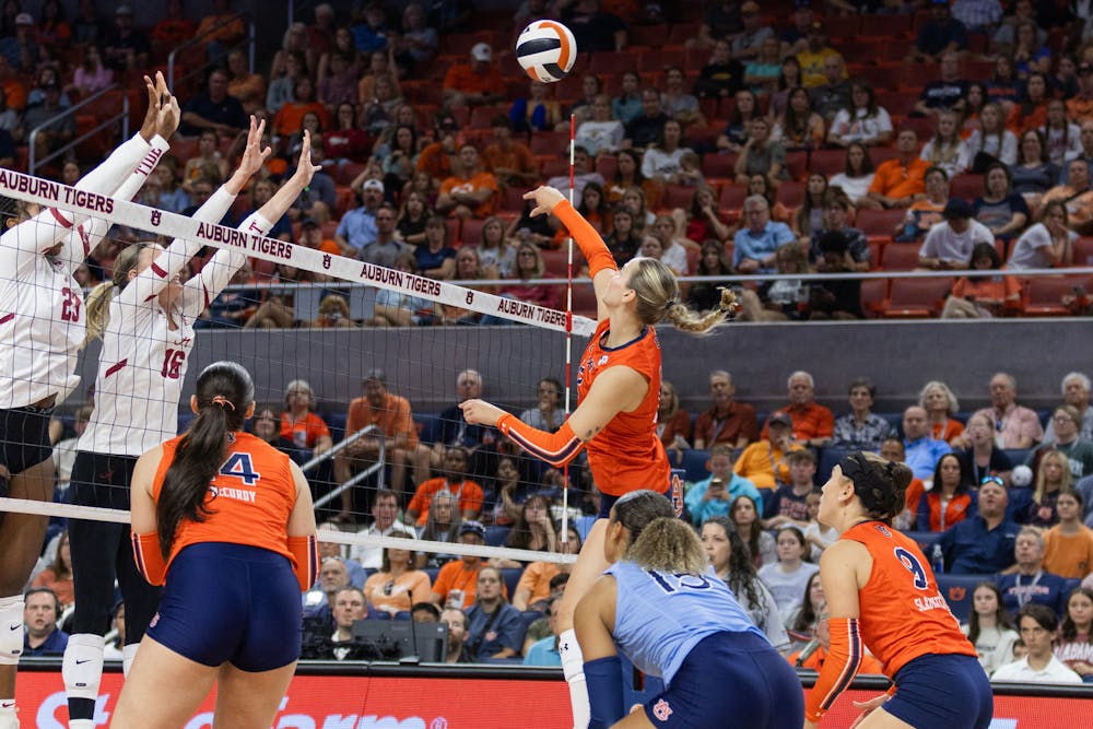 Bel Zimmerman spikes a ball over Alabama during Auburn vs Alabama on Sept 29, 2024. 