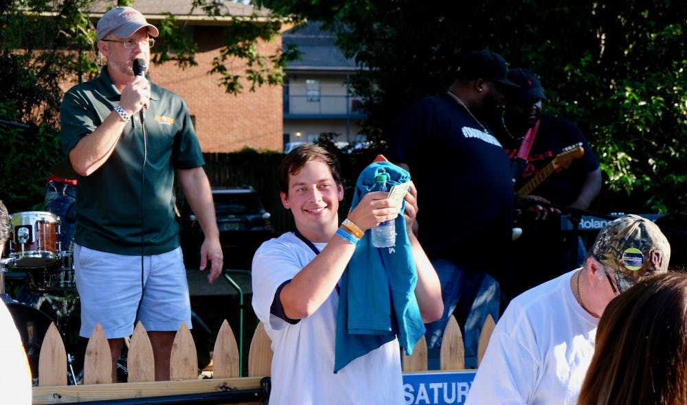 Man celebrates after winning the wing eating competition July 28, 2018,&nbsp; at the Greystone Mansion in Auburn, Ala.