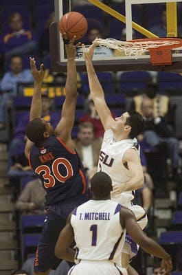 Auburn senior center Brendon Knox (30) tips the ball over LSU sophomore guard Garrett Green (3) on Jan. 20 during Auburn's 84-80 win against LSU in the PMAC in Baton Rouge, La.