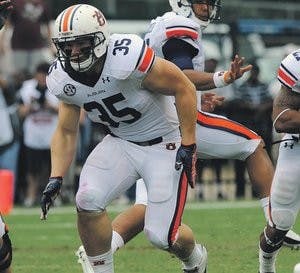 Fullback Jay Prosch blocks for Tre Mason during the Mississippi State game Saturday, Sept. 8. (Courtesy of Todd Van Emst)