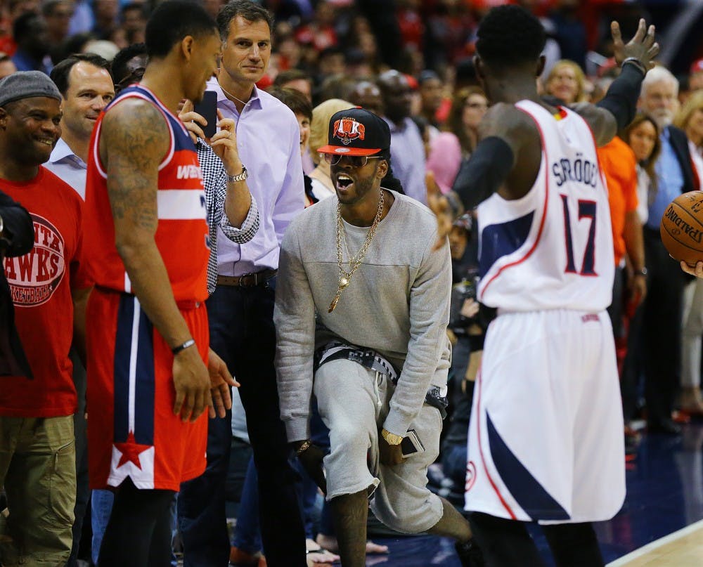 Rap artist 2 Chainz taunts the Washington Wizards' Bradley Beal from his seat as Beal prepares to inbounds the ball in the final minute of Game 5 of the Eastern Conference semifinals on Wednesday, May 13, 2015, at Philips Arena in Atlanta. The Hawks won, 82-81, for a 3-2 series lead. (Curtis Compton/Atlanta Journal-Constitution/TNS)