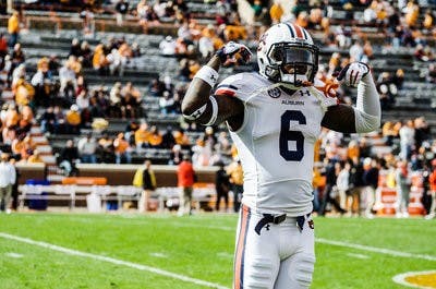 Jonathon Mincy flexes for Auburn's fans during the Tigers' blowout win at Tennessee last season.