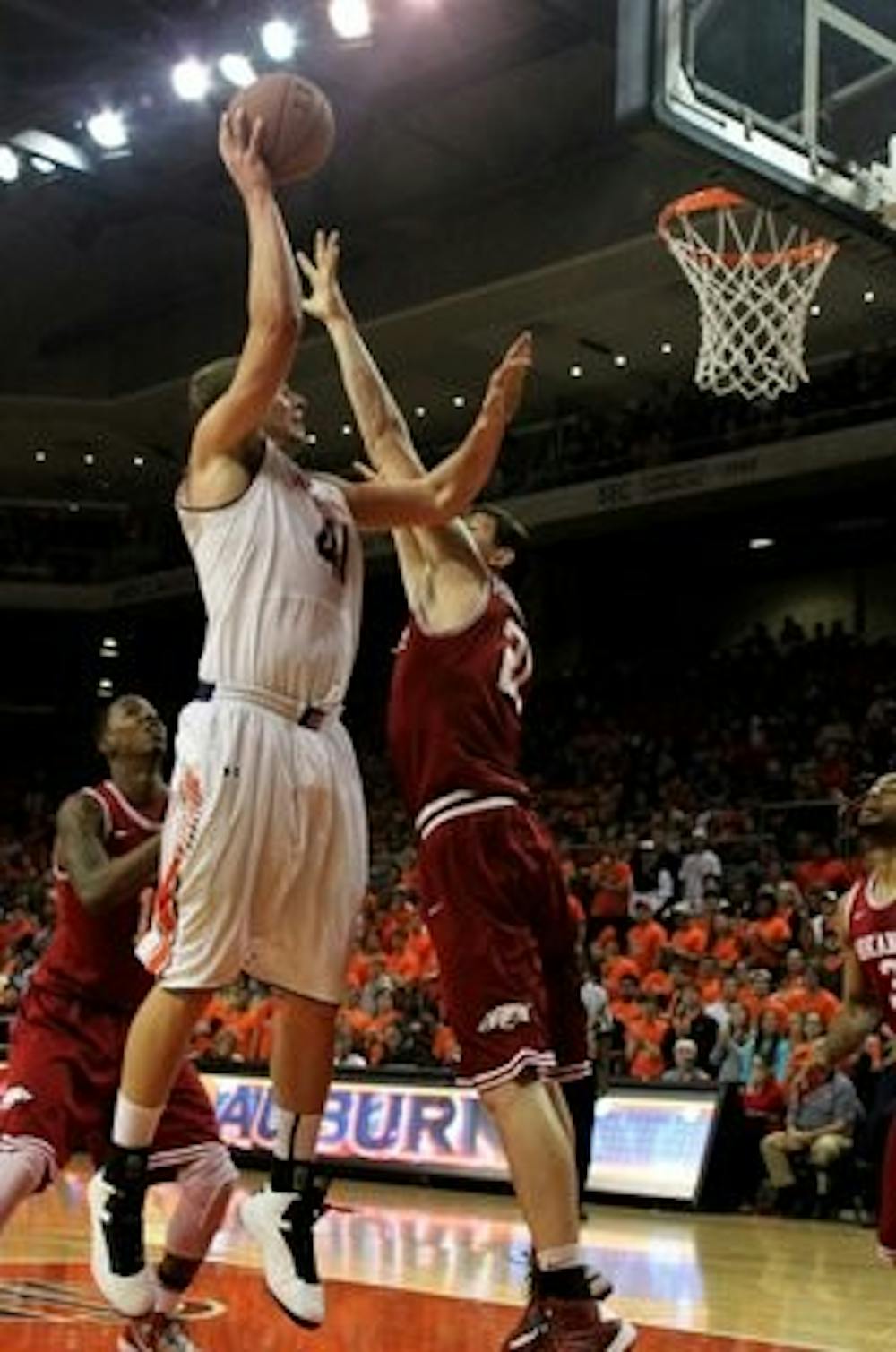 Rob Chubb gets pressured by the Arkansas Defense while taking a shot. (Katherine McCahey / ASSISTANT PHOTO EDITOR)