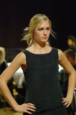 Gilda Osborn, sophomore in prenursing, walks the runway during the Couture for the Cure fashion show Thursday. (Charlie Timberlake / ASSISTANT PHOTO EDITOR)