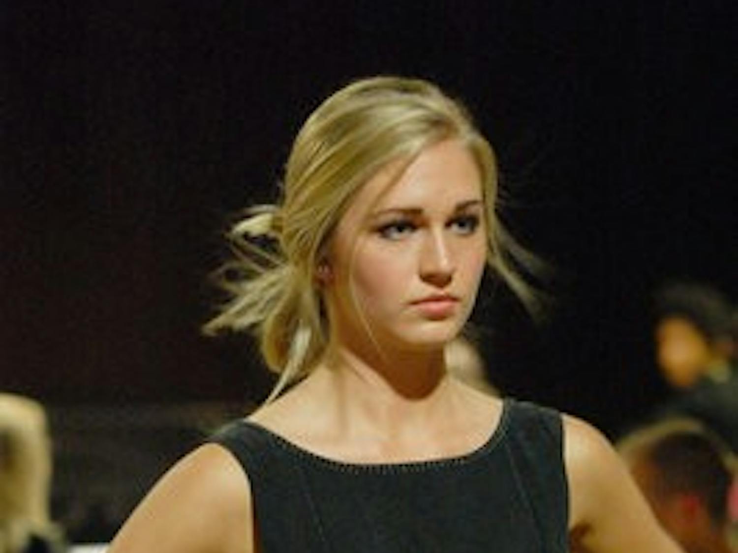 Gilda Osborn, sophomore in prenursing, walks the runway during the Couture for the Cure fashion show Thursday. (Charlie Timberlake / ASSISTANT PHOTO EDITOR)
