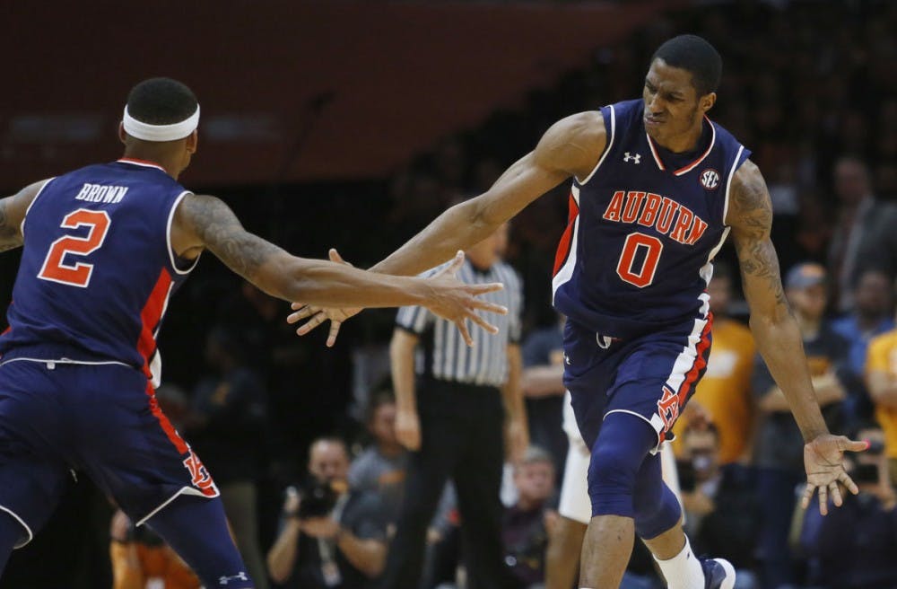 <p>Auburn forward Horace Spencer (0) is congratulated by guard Bryce Brown (2) after dunking the ball against Tennessee on Tuesday, Jan. 2, 2018, in Knoxville, Tenn. (AP Photo/Crystal LoGiudice)</p>