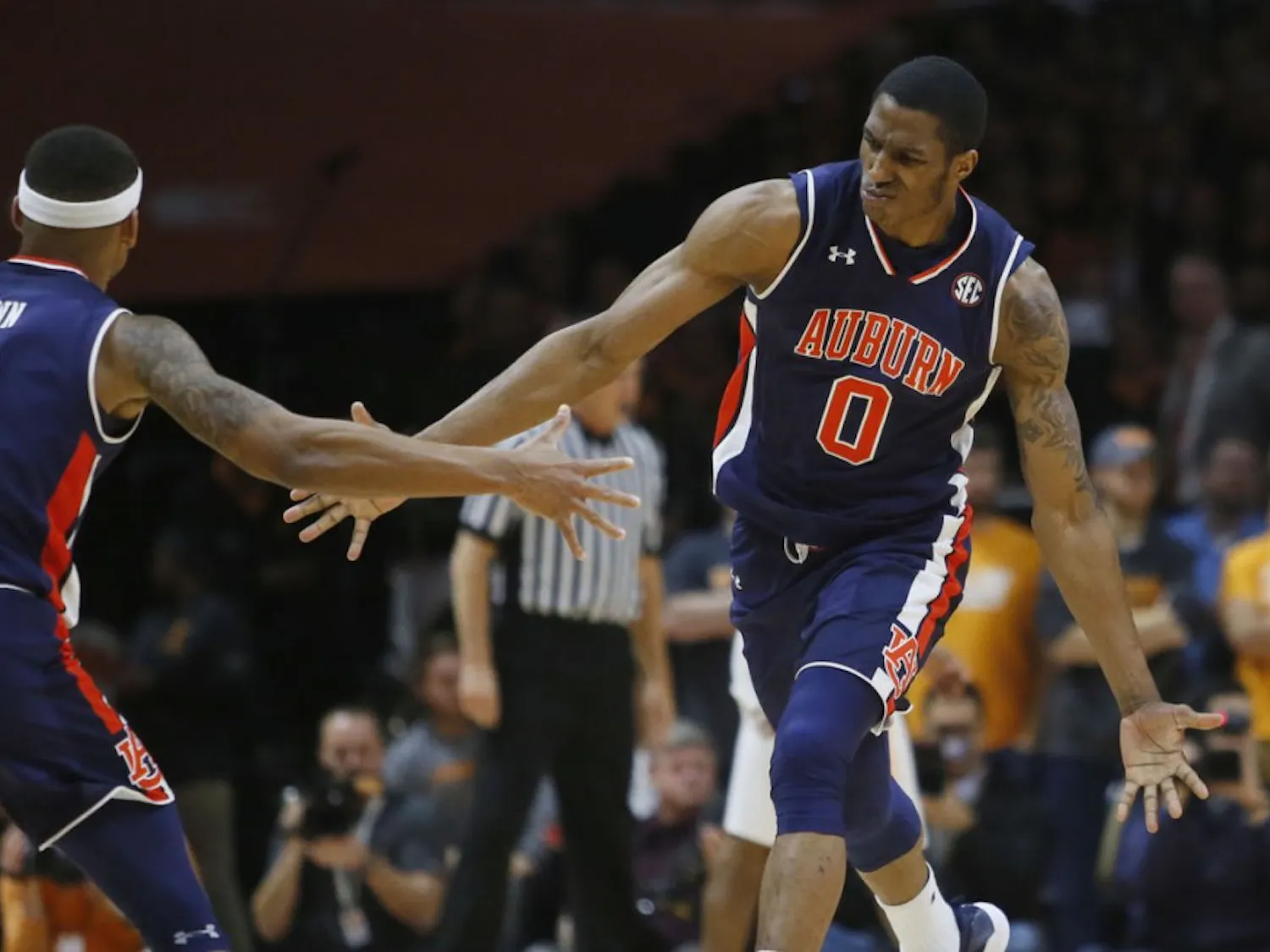 Auburn forward Horace Spencer (0) is congratulated by guard Bryce Brown (2) after dunking the ball against Tennessee on Tuesday, Jan. 2, 2018, in Knoxville, Tenn. (AP Photo/Crystal LoGiudice)