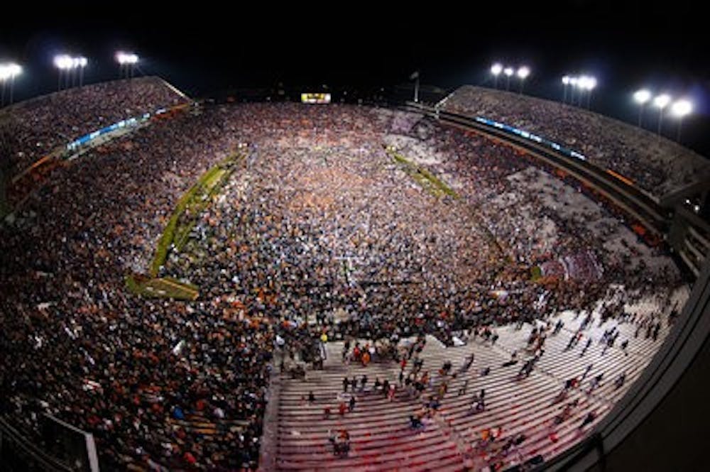 Fans storming the field following Auburn's win against Alabama. (Zach Bland / PHOTOGRAPHER)