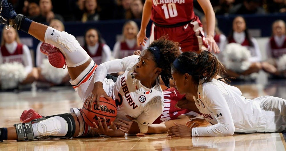<p>Auburn's Erica Sanders recovers a loose ball in the second half. Alabama vs Auburn Game 6 SEC Women's SEC Basketball Tournament on Thursday, March 7, 2019 in Greenville, SC.</p>