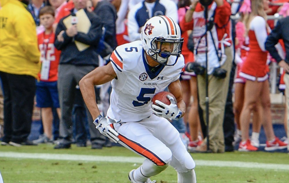 <p>Anthony Schwartz (5) runs the ball during Auburn Football vs. Ole Miss on Saturday, Oct. 20, 2018, in Oxford, Miss.</p>