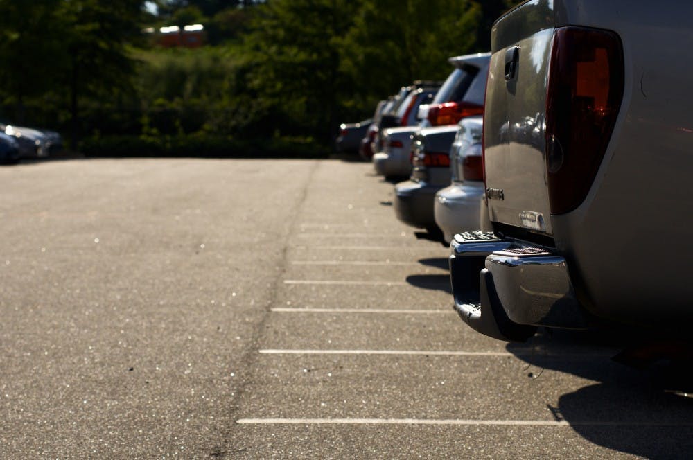 <p>Cars fill parking spaces in Resident Overflow parking lot at Auburn University on Tuesday, Aug. 22, 2017 in Auburn, Ala.</p>