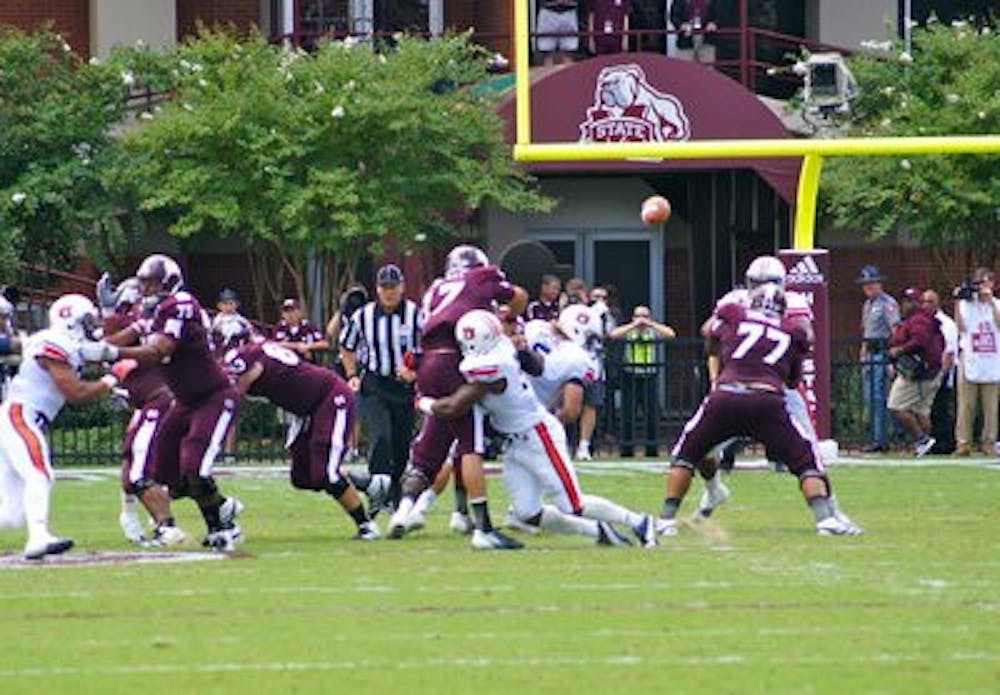 Defensive end Corey Lemonier takes down Mississippi State quarterback Tyler Russell