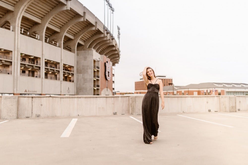 Paige Purvis, senior in apparel merchandising, poses in Rent the Runway gown in Auburn, Ala.